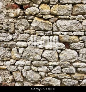 Old random stone wall, Indre, France. Stock Photo