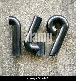 House number “149” in modern style on street in Brussels, Belgium. Stock Photo