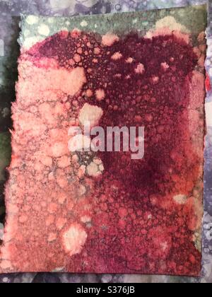 Soap bubble and food coloring bubble print abstract background on watercolor paper Stock Photo