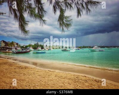 Cloudy day on the beach in Grand Baie, North Mauritius. Stock Photo