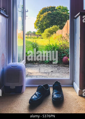 Back patio door leads from the lounge out into the garden. Stock Photo