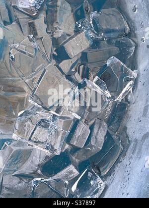 Abstract background of ice cubes with aqua and gray colored reflections Stock Photo