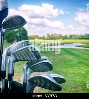 Golf clubs ready to use at a golf course Stock Photo