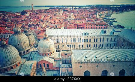 A photograph looking out over rooftops in Venice, Italy. Stock Photo