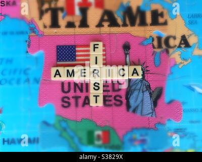 America First, or America alone, in words, icons, and 3D puzzle map. USA fading. MAGA. In Decline. Lost hegemony. Adrift Stock Photo