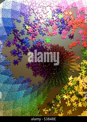 Completing a large jigsaw puzzle Stock Photo