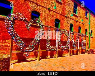 Love locks. Love sign installation made it with padlocks at The Distillery District in Downtown Toronto. Stock Photo