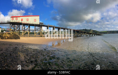 The old lifeboat house and slipway on Tenby’s north beach, July. Stock Photo