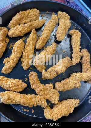 Hot Spicy Chicken Bites fresh from the oven. Stock Photo