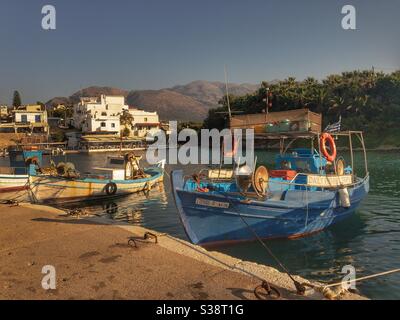 Small fishing boats in harbour in Crete Stock Photo