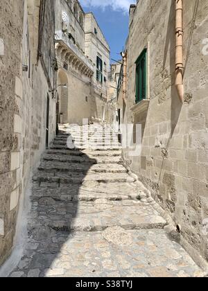 Empty street with stone/rock staircase leading up in Matera, Basilicata, Italy Stock Photo