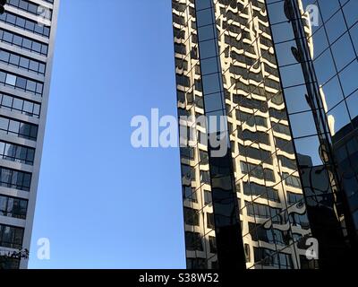 LOS ANGELES, CA, JUN 2020: windows and reflections on tall buildings in Downtown at the intersection of Wilshire Blvd and S Grand Ave Stock Photo