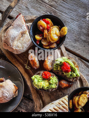 Sunday brunch for two on a wooden board Stock Photo