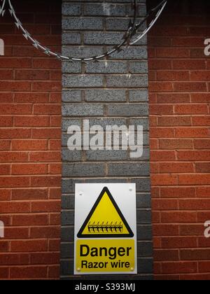 Danger razor wire warning sign Stock Photo