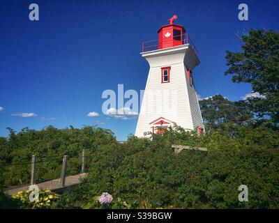 Small lighthouse in the village of Victoria by the sea, Prince Edward Island, Canada. Stock Photo