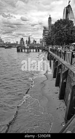 A photograph of part of the Thames embankment in London, UK. Cloudy overcast day, black and white photography. Stock Photo