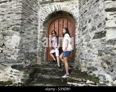 Two Ladies Entering the Old Castle Stock Photo