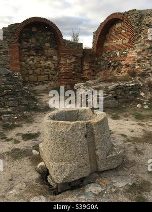 Water well and brick arches in the ancient Roman and Greek harbor at Histria Dobrogea Romania Stock Photo