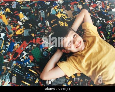 Young boy happy with his LEGO collection Stock Photo