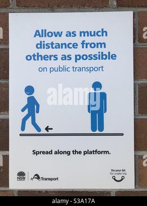 Sign to encourage social distancing during the COVID-19 (coronavirus) pandemic on a platform at Strathfield station in Sydney, NSW, Australia. Stock Photo