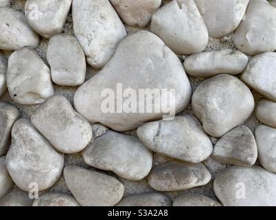 Abstract background texture created by large, smooth, grey stones Stock Photo