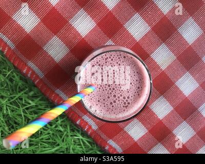 Fruit smoothie against a picnic background Stock Photo