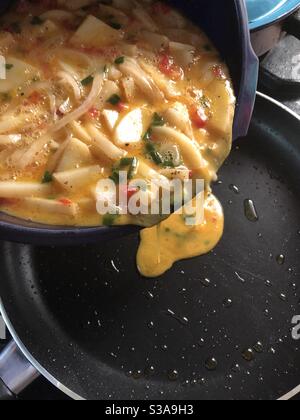 Cooking a Spanish Tortilla with potatoes, it is yummy! Stock Photo