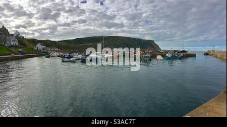 Boats in the harbour of Gardenstown, Aberdeenshire, Scotland Stock Photo