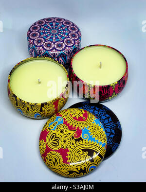 Colorful, paisley Boho tins made into scented soy wax candles. I hand pour these candles. Stock Photo