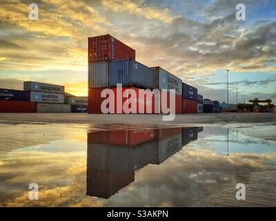 Containers stacked on a ship ready to be transported Stock Photo - Alamy