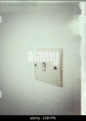 Old fashioned light switch with grunge effects. Stock Photo