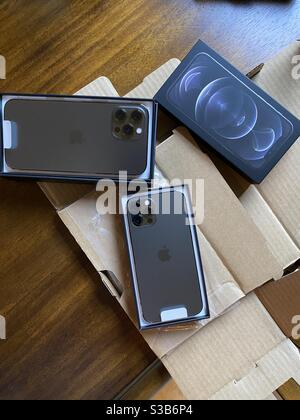 New Apple iPhone 12 pro and pro max phones with packaging Stock Photo