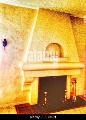 Vintage plaster fireplace in old California Spanish hacienda style. 1920s house in Inglewood, Los Angeles, CA, USA Stock Photo