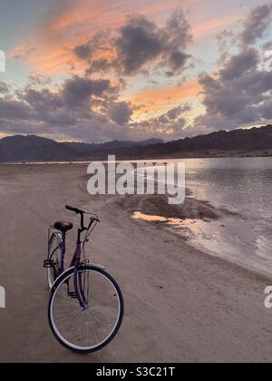 Bicycle on the sunset beach, Dahab, Egypt Stock Photo