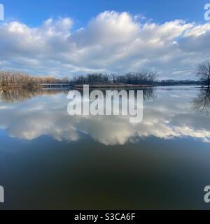 Reflection of trees and clouds at Skokie Lagoons, part of the Forest Preserve of Cook County, Illinois. Stock Photo