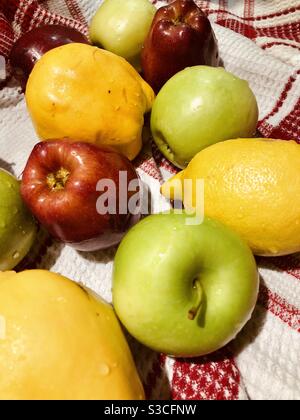 Apples, lemon, coins freshly washed Stock Photo
