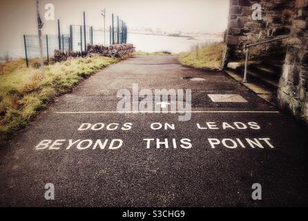 Dogs on Leads Beyond This Point on The Coastal Path outside Bangor, County Down, Northern Ireland Stock Photo