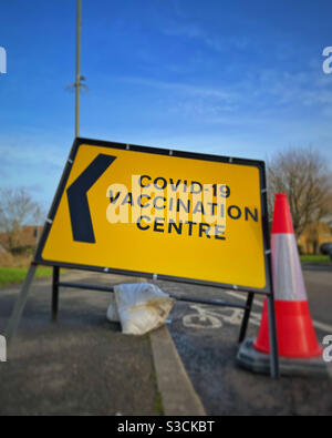COVID-19 vaccination centre sign at side of road. Stock Photo