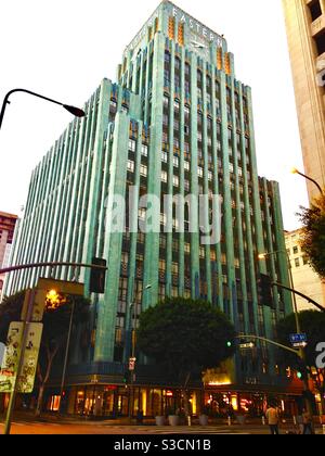 The beautiful turquiose art deco Eastern Columbia Building in the Broadway theater district of downtown Los Angeles was designed by Claud Beelman, built in 1930 & features a four-sided clock tower. Stock Photo