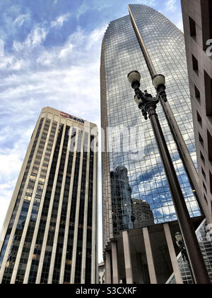 Tall buildings in San Francisco with reflections and lamp post Stock Photo