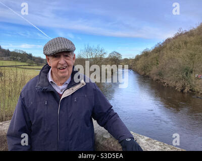 Elderly farmer on Barden Bridge River Wharfe North Yorkshire Stock Photo