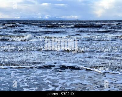 Beautiful Scenic view of ocean  sea from Prestwick beach, Ayrshire, Scotland on Firth of Clyde, west coast. Isle of Arran in distance. Stock Photo