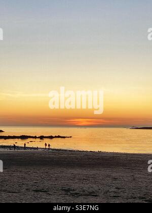 March sunset on Rhosneigr beach, Anglesey, North Wales, IK Stock Photo