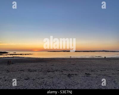 Sunset on Rhosneigr beach, Anglesey, north wales, UK, March evening Stock Photo