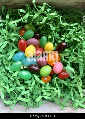 Jellybeans in green Easter grass Stock Photo