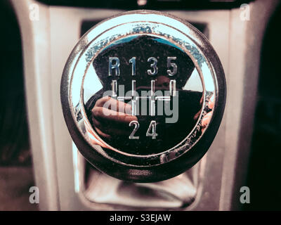Top of a gear stick in a manual transmission car. Stock Photo