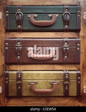 Vintage travel luggage or old fashioned suitcases stacked on top of each other Stock Photo