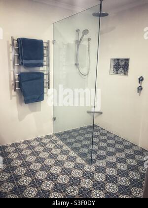 Shower and tiled floor in a bathroom in Brisbane, Australia Stock Photo