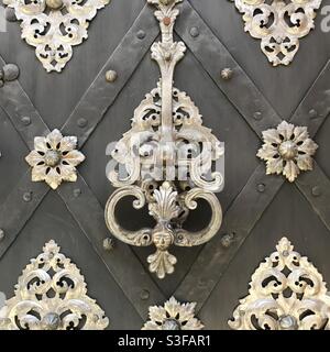 Detailed View of a Vintage Knocker on an Old Gate Stock Photo