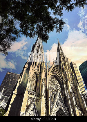The iconic St. Patrick’s Cathedral is located on Fifth Avenue across from Rockefeller Center,, NYC, USA Stock Photo